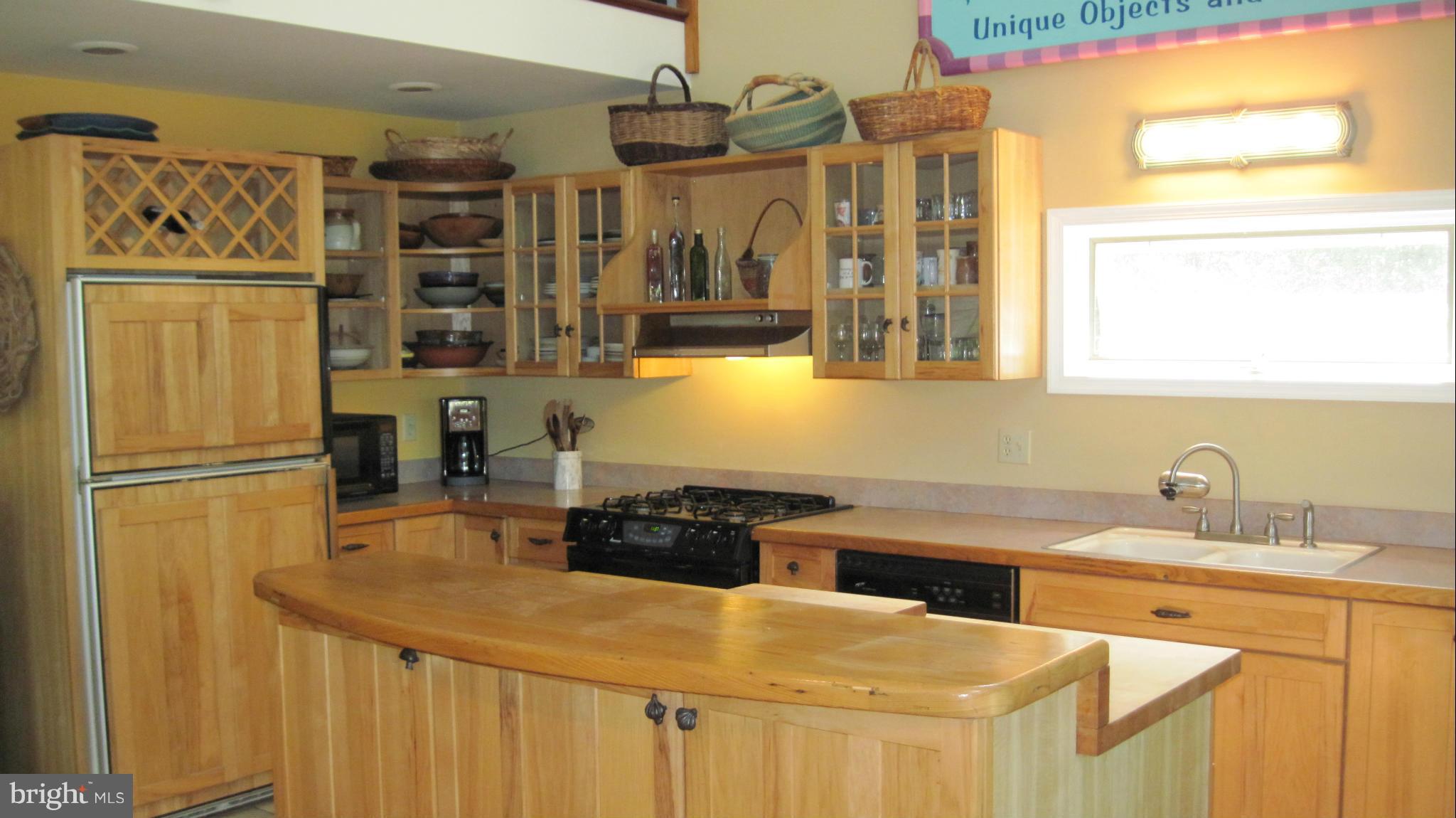 9041 New Road McDaniel, MD 21647 - Photo 8 of 30 Warm wood kitchen with island