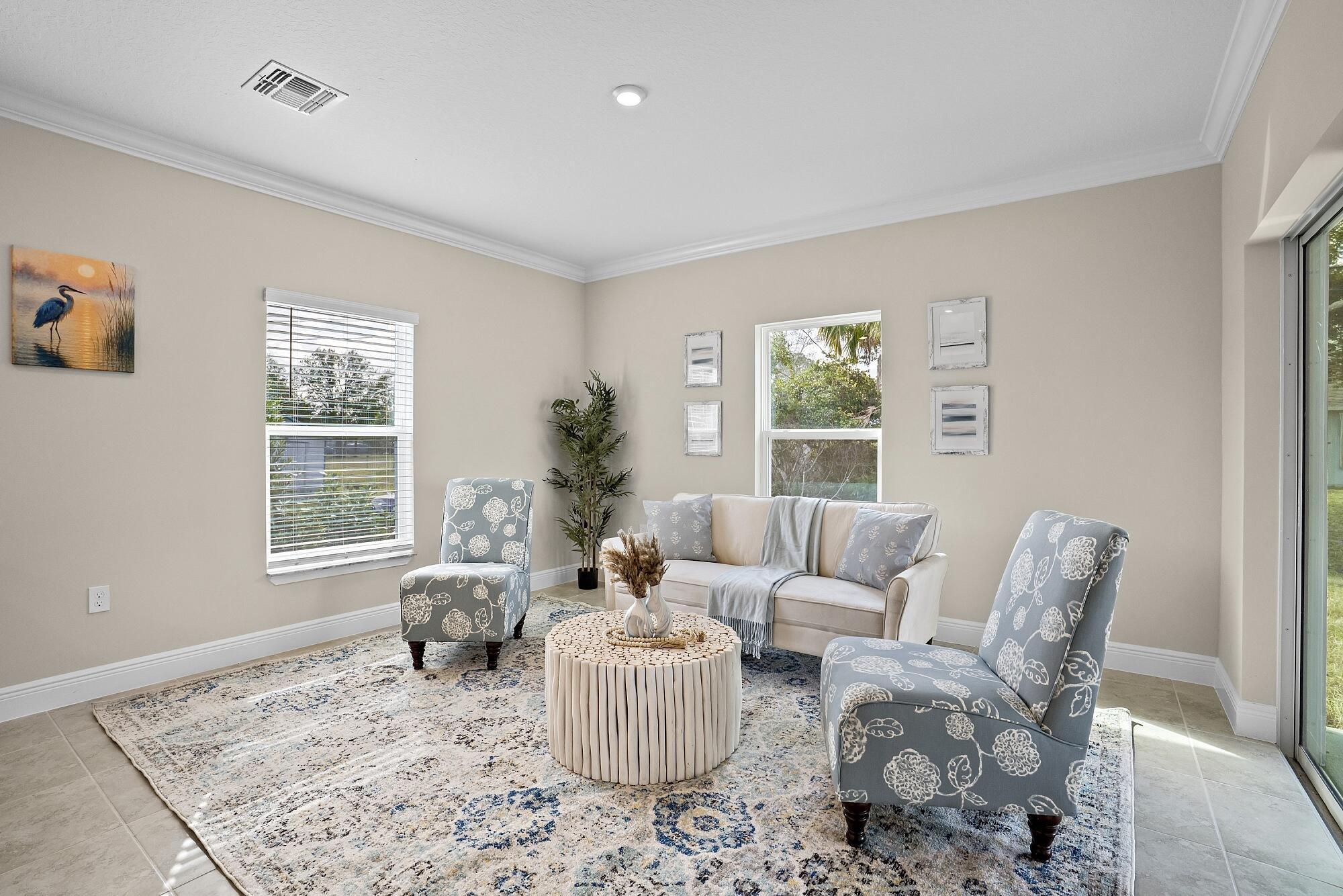 418 Easy Street Sebastian, FL 32958 - Photo 20 of 42 a living room with furniture and a window