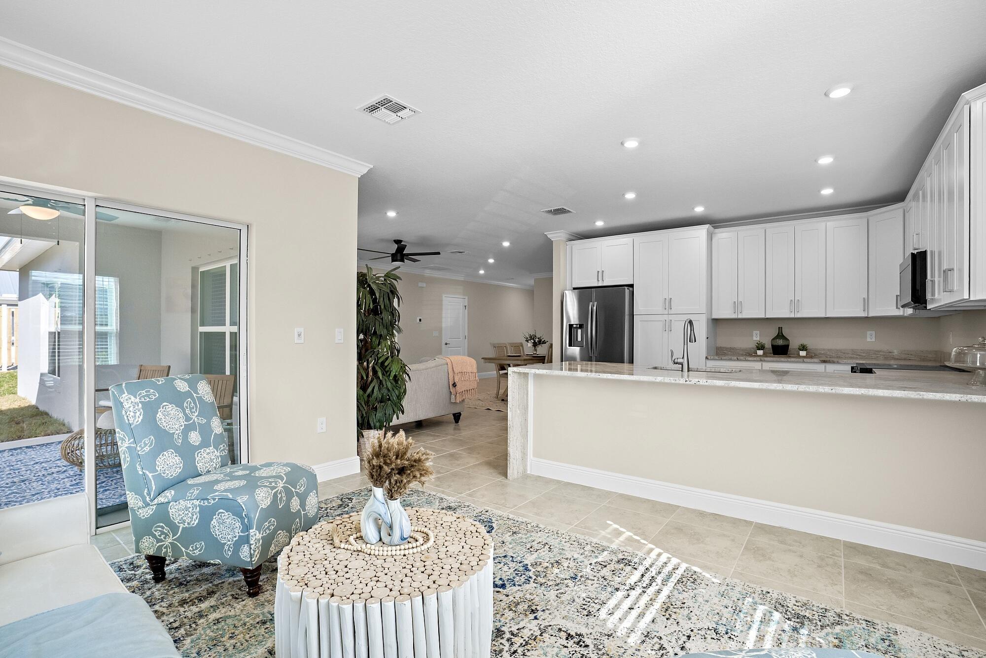 418 Easy Street Sebastian, FL 32958 - Photo 23 of 42 a living room with furniture and kitchen view