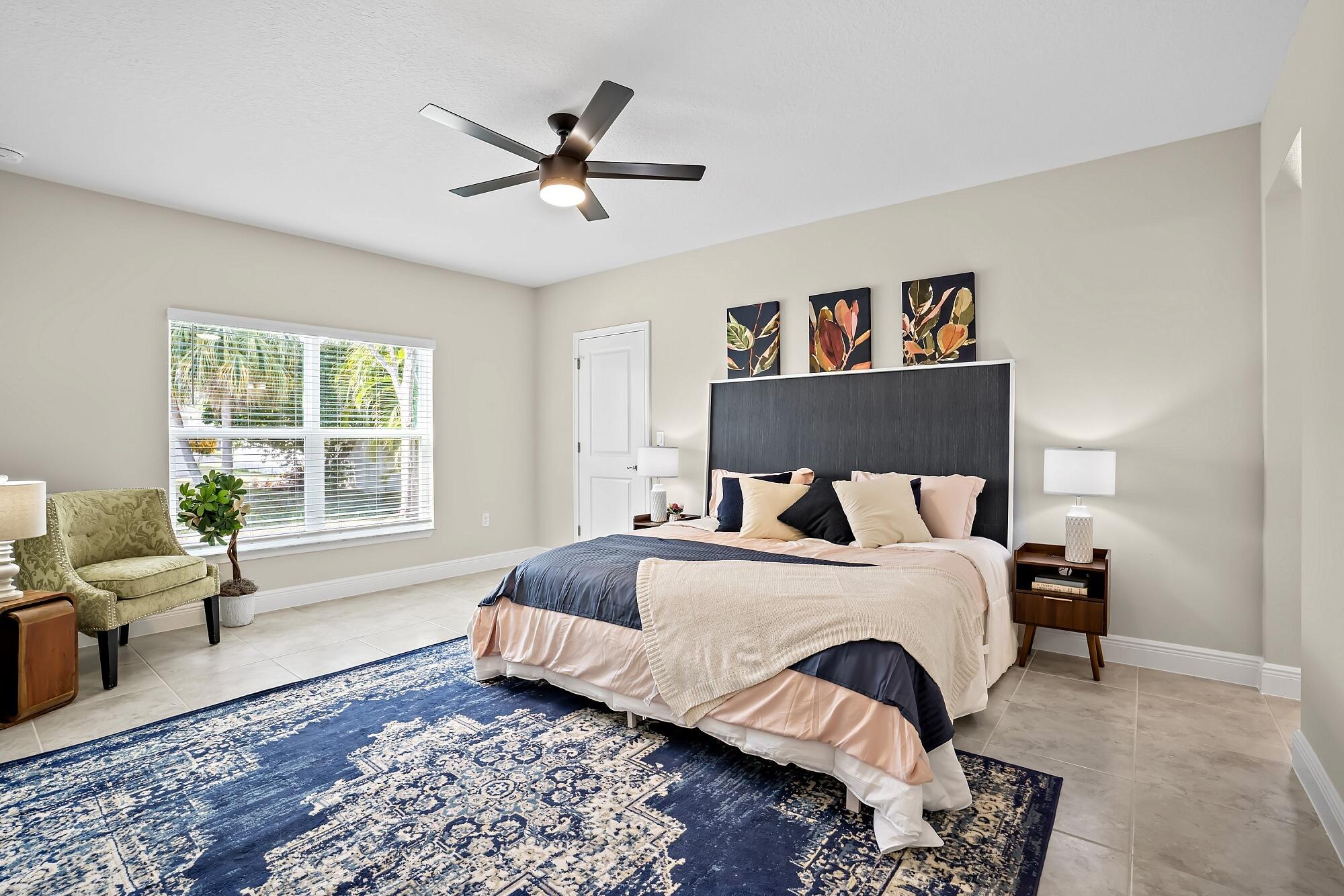 418 Easy Street Sebastian, FL 32958 - Photo 24 of 42 a bedroom with a bed furniture and a window