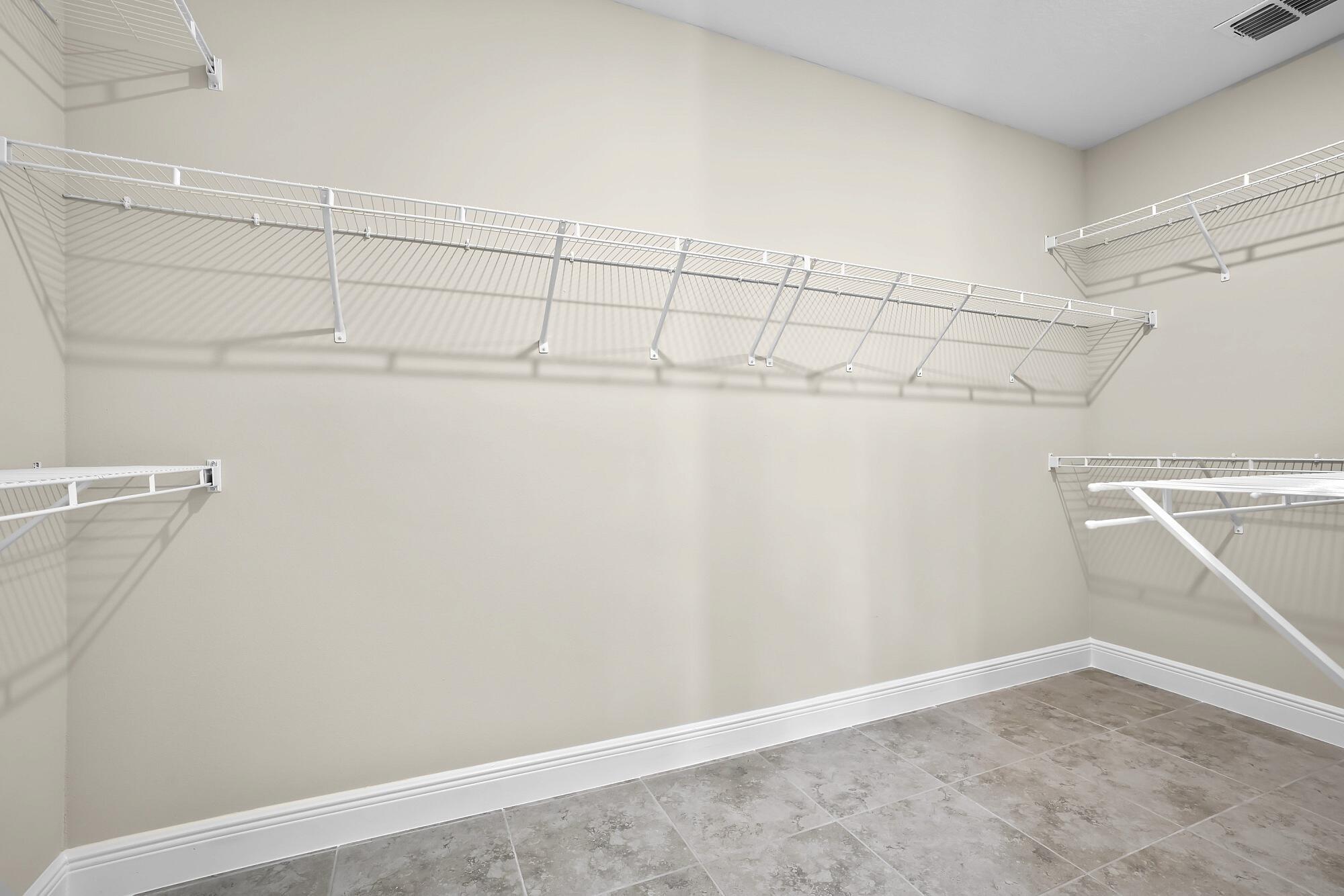 418 Easy Street Sebastian, FL 32958 - Photo 29 of 42 a view of a room with racks on the wall