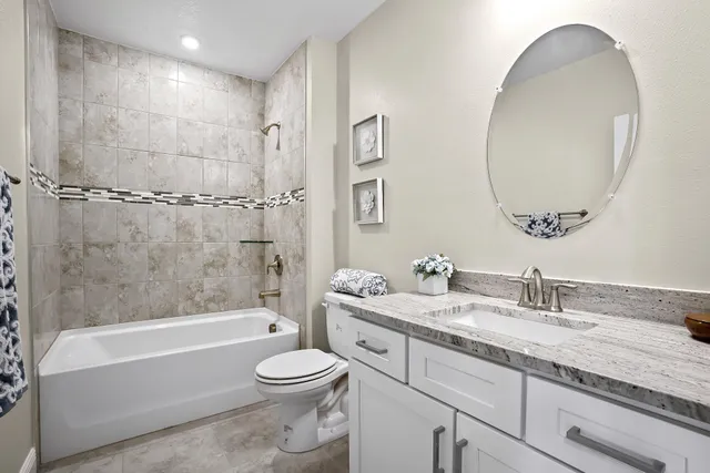 a view of a porch with furniture and a yard