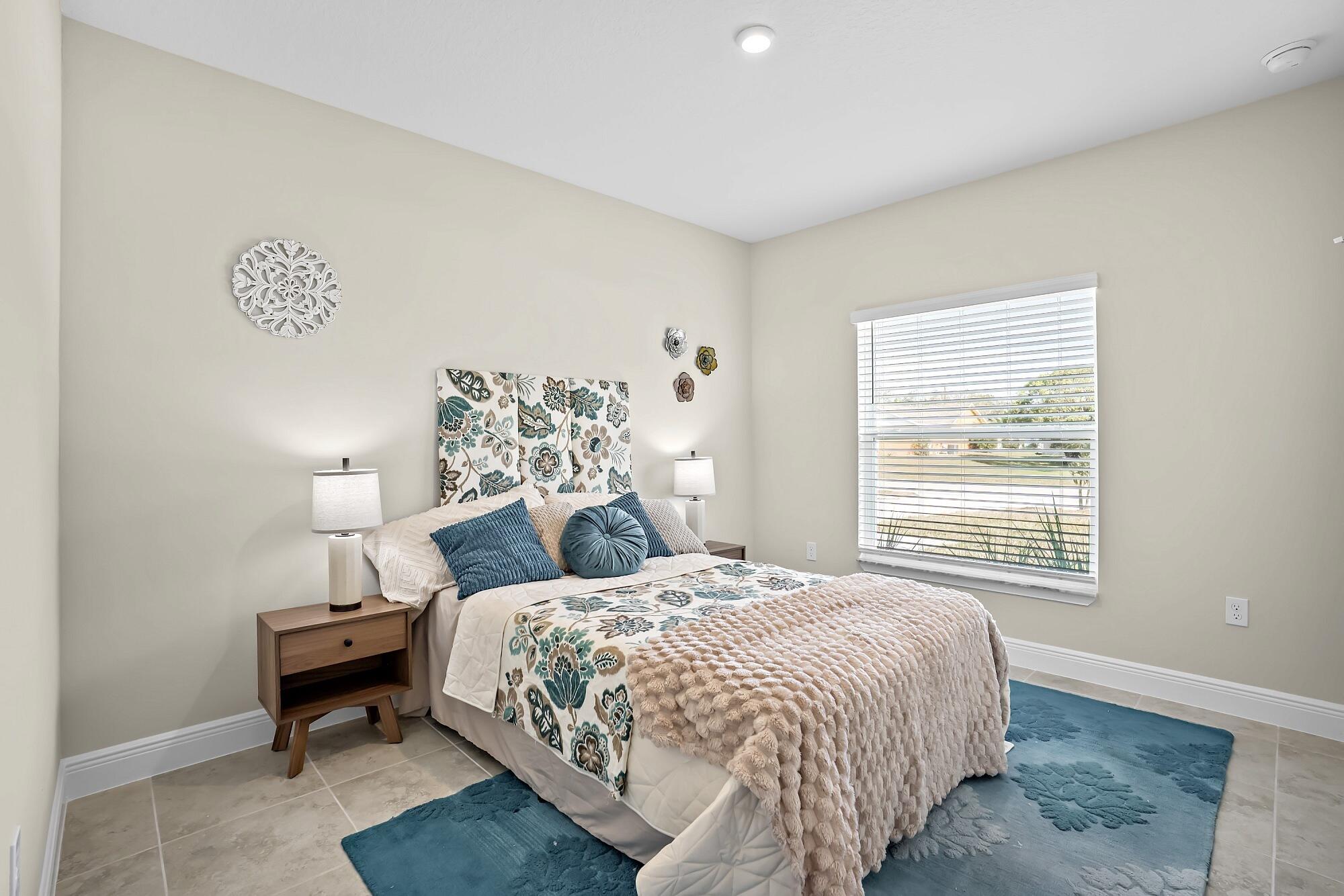 418 Easy Street Sebastian, FL 32958 - Photo 35 of 42 a bedroom with a bed and a window