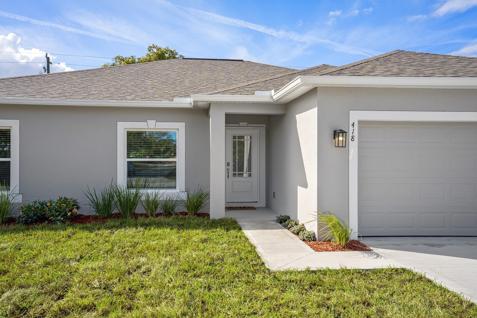 418 Easy Street Sebastian, FL 32958 - Photo 5 of 42 a view of a house with potted plants