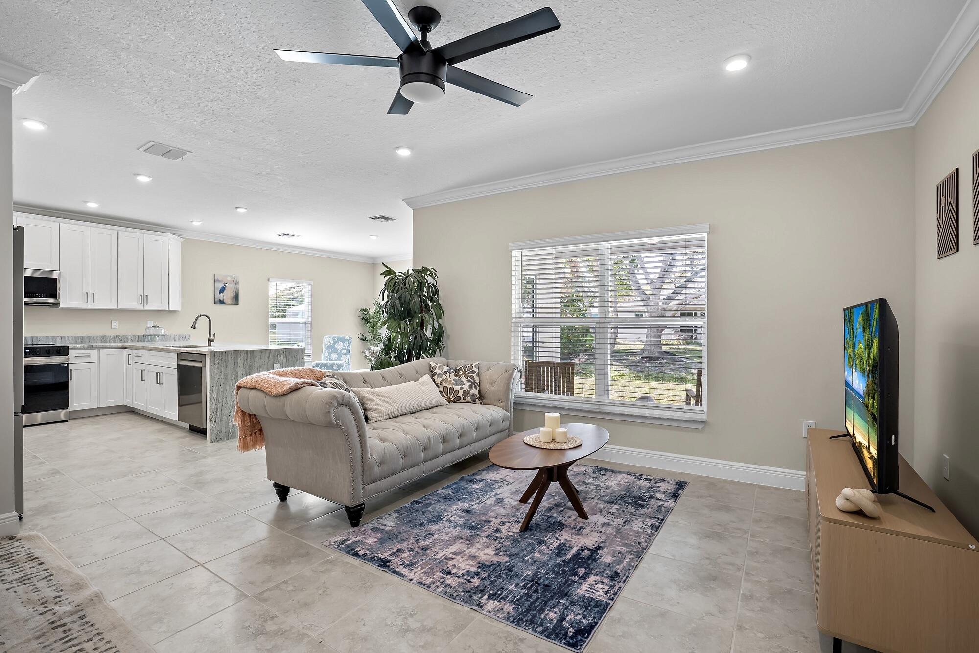 418 Easy Street Sebastian, FL 32958 - Photo 8 of 42 a living room with furniture and a flat screen tv