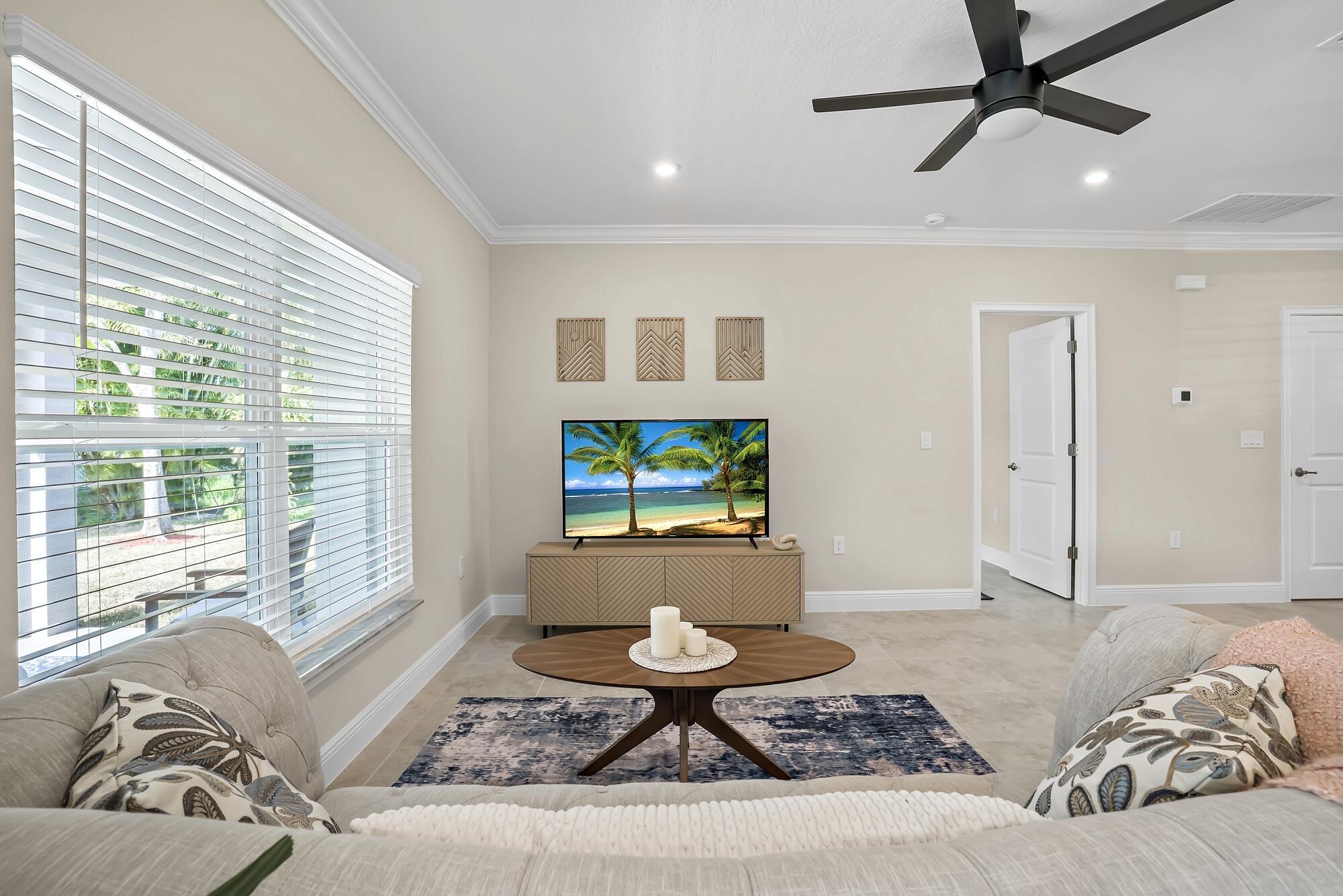 418 Easy Street Sebastian, FL 32958 - Photo 10 of 42 a living room with furniture and a flat screen tv