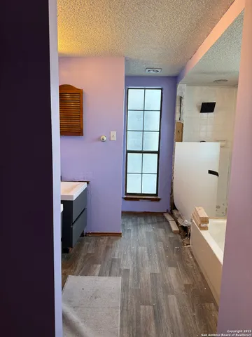 a bathroom with a sink and mirror