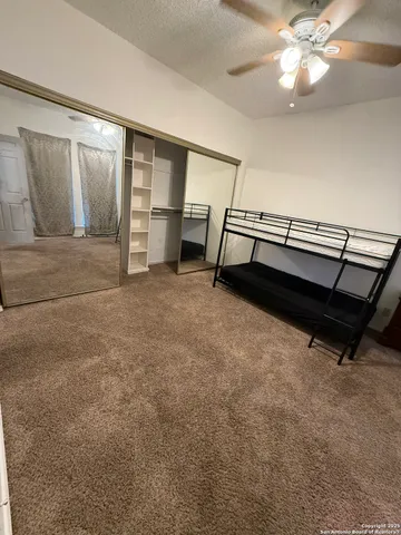 a bathroom with a sink a toilet a shower and a mirror