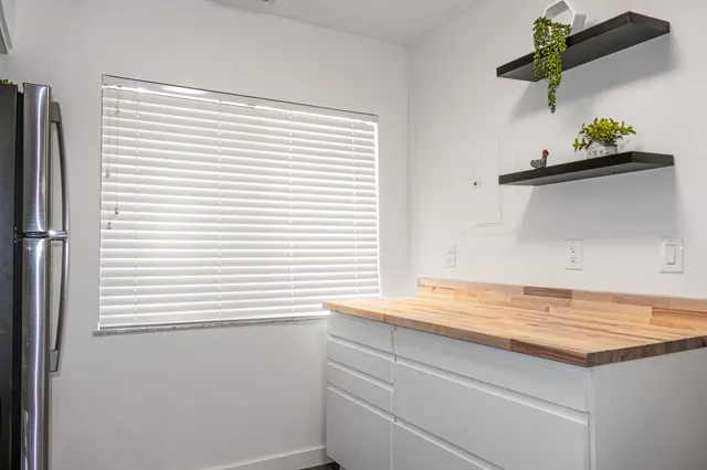 a view of window with wooden floor