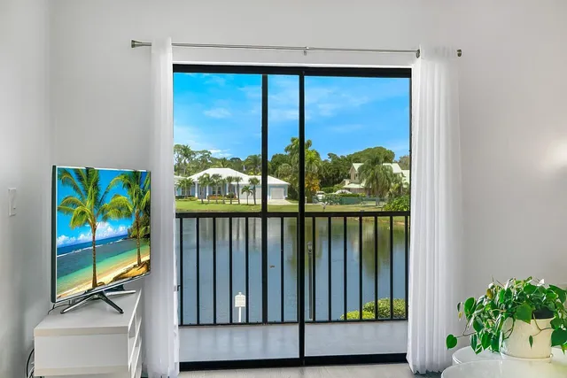 a view of a balcony with furniture