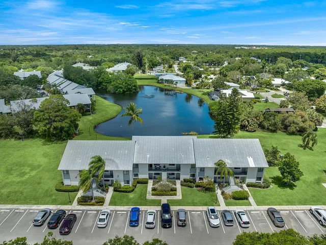 an aerial view of house with yard swimming pool and outdoor seating