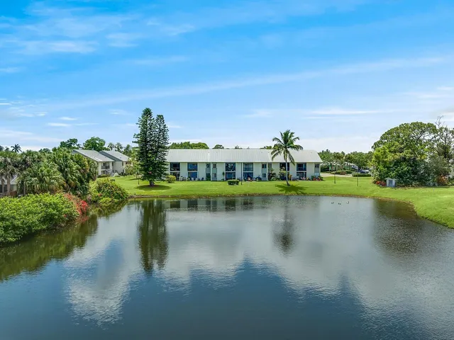 a view of a lake with houses in the back