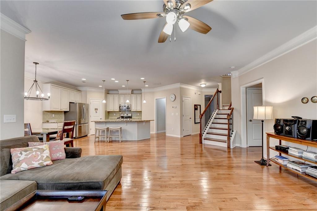 2455 Matlin Way Buford, GA 30519 - Photo 11 of 58 a living room with furniture and kitchen view