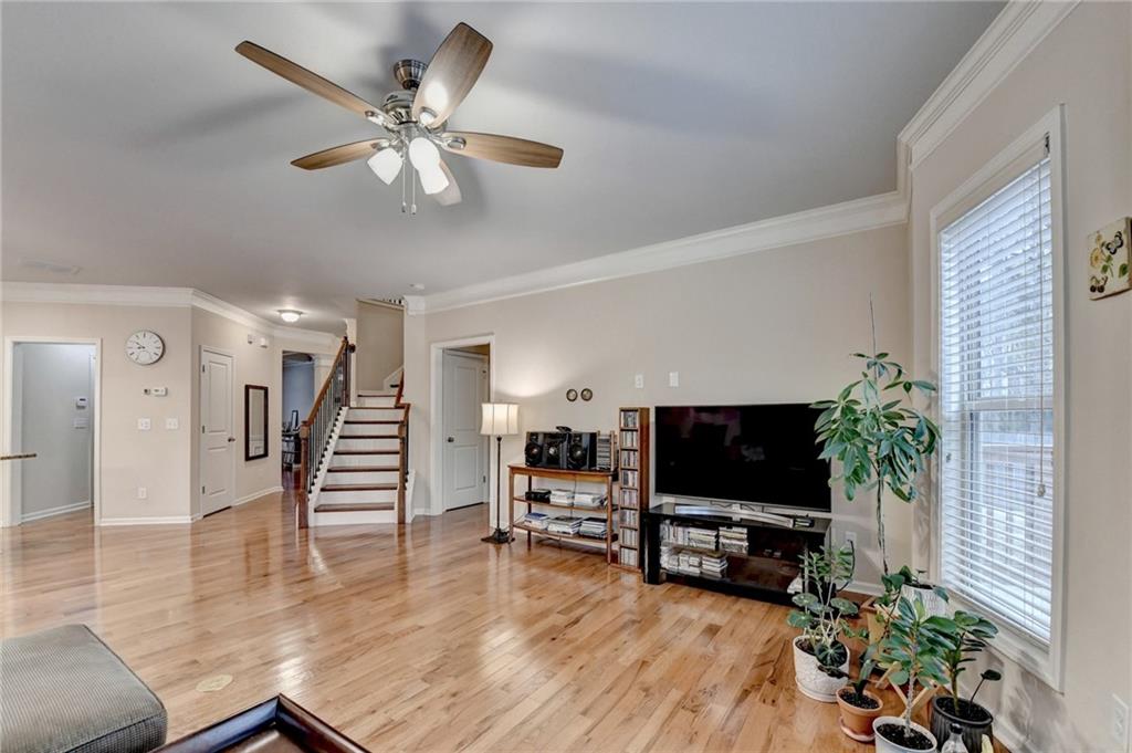 2455 Matlin Way Buford, GA 30519 - Photo 12 of 58 a living room with furniture and a flat screen tv