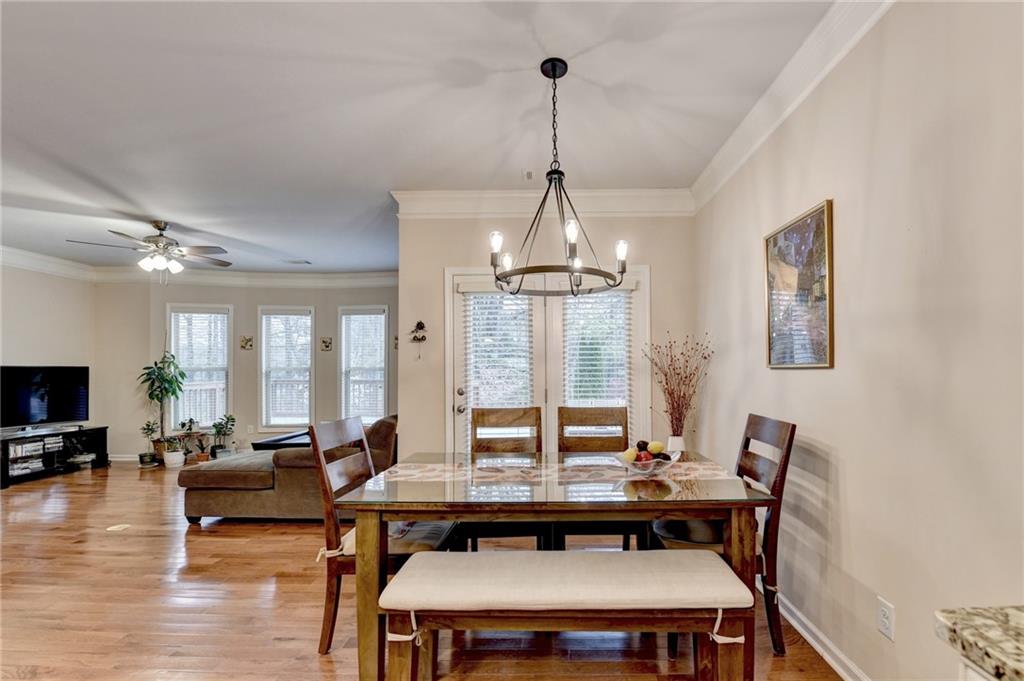 2455 Matlin Way Buford, GA 30519 - Photo 25 of 58 a view of a livingroom with furniture and a chandelier