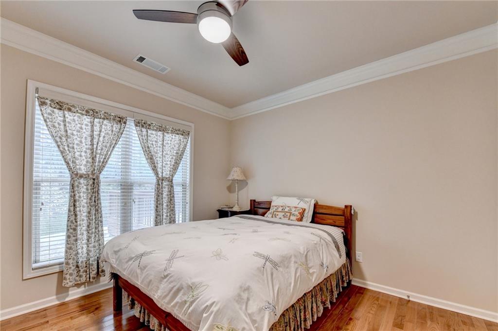 2455 Matlin Way Buford, GA 30519 - Photo 27 of 58 a bedroom with a bed and a window