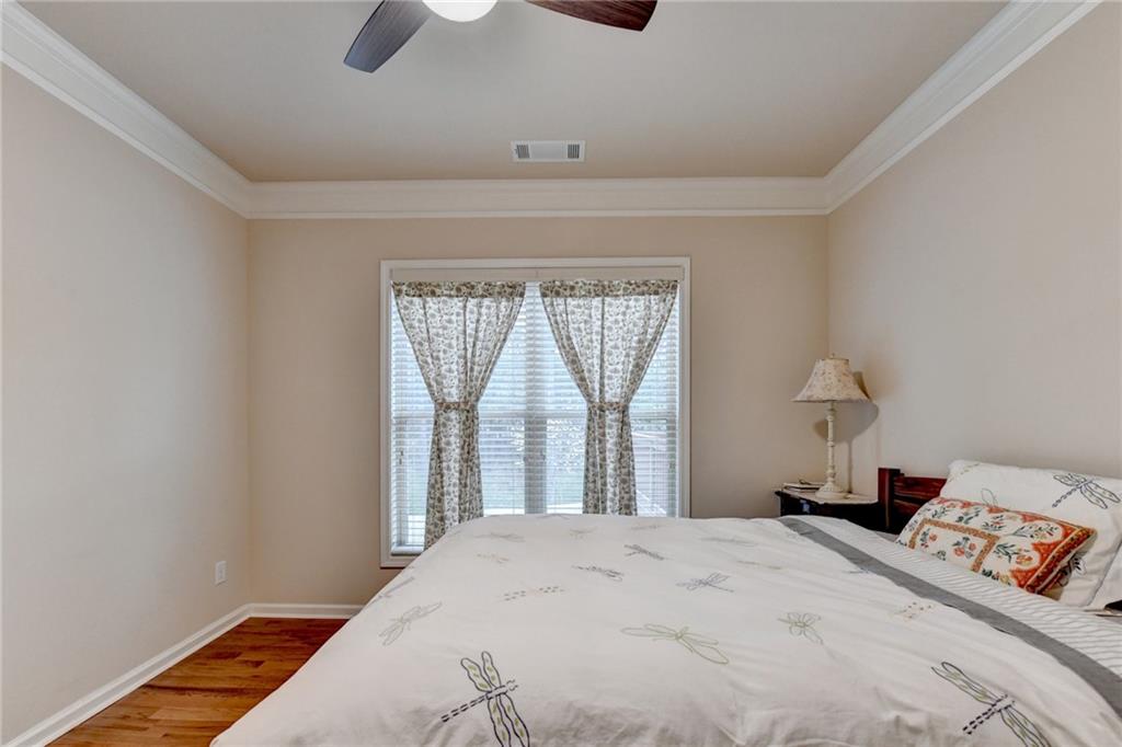 2455 Matlin Way Buford, GA 30519 - Photo 29 of 58 a bedroom with a bed and a window