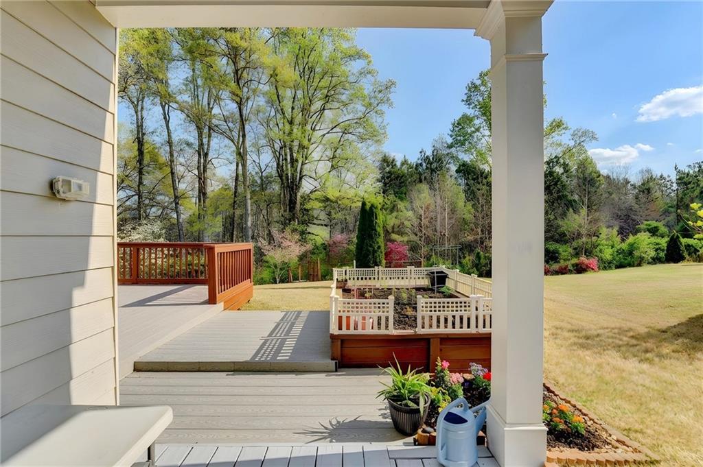 2455 Matlin Way Buford, GA 30519 - Photo 49 of 58 a view of a patio with couches and table and chairs and potted plants