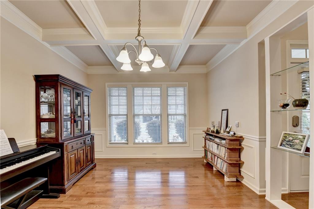 2455 Matlin Way Buford, GA 30519 - Photo 5 of 58 a view of a room with wooden floor chandeliers and windows