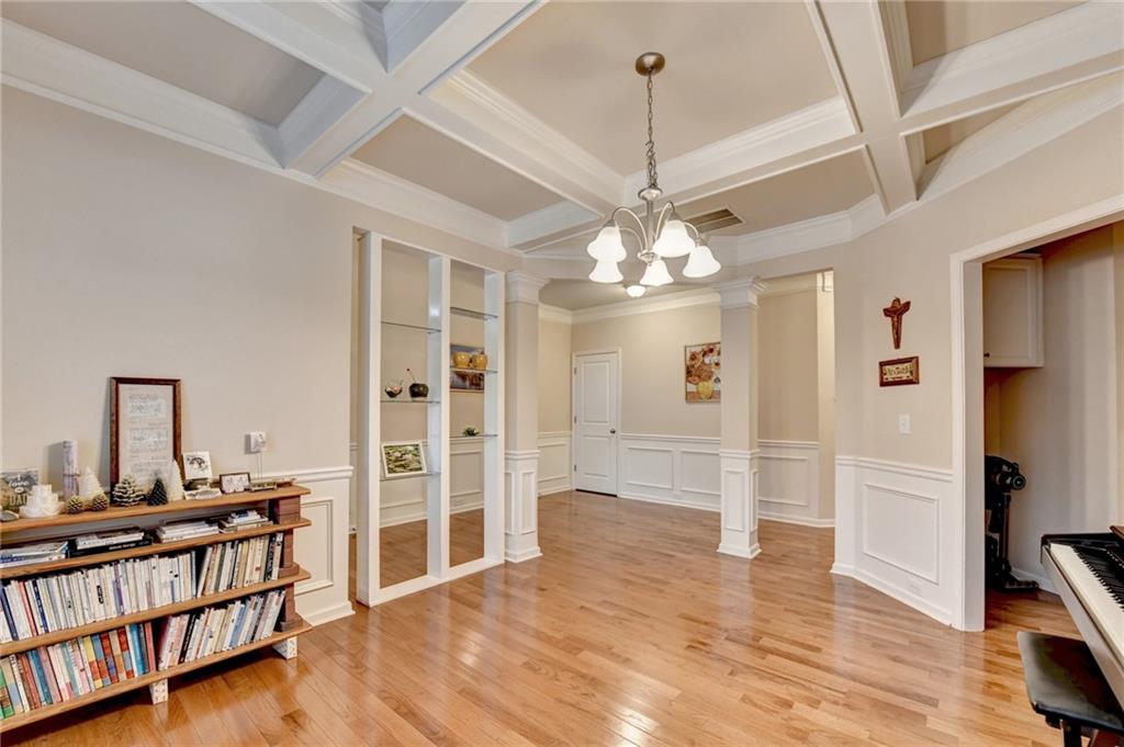 2455 Matlin Way Buford, GA 30519 - Photo 6 of 58 a view of a livingroom with a furniture wooden floor and chandelier