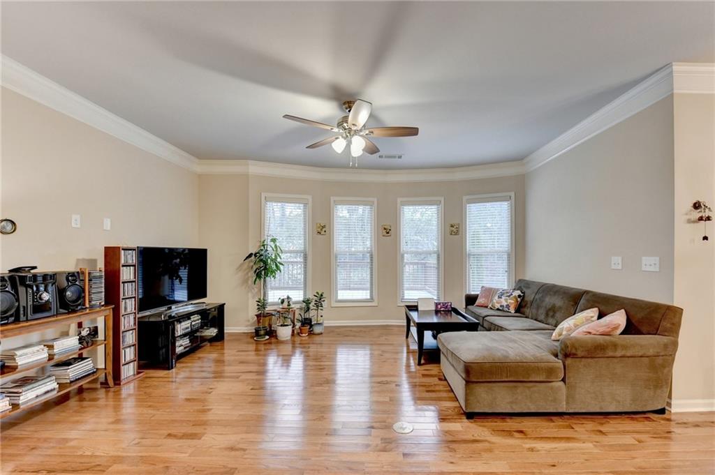2455 Matlin Way Buford, GA 30519 - Photo 8 of 58 a living room with furniture and a flat screen tv
