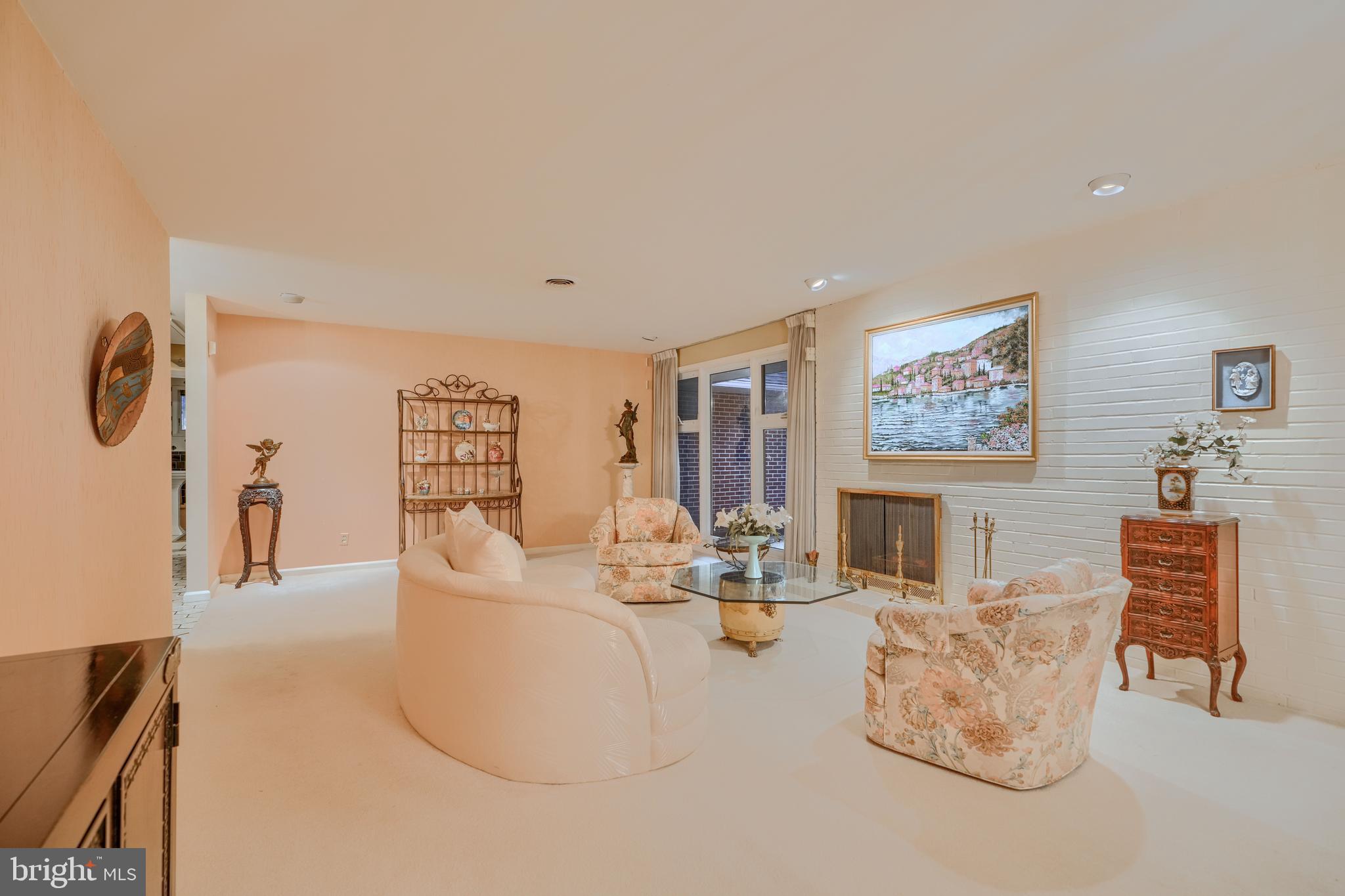 7900 Ivy Lane Baltimore, MD 21208 - Photo 12 of 32 a living room with furniture and a flat screen tv