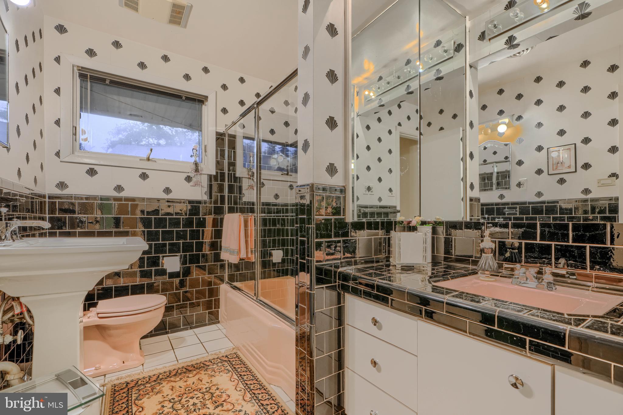 7900 Ivy Lane Baltimore, MD 21208 - Photo 20 of 32 a kitchen with stainless steel appliances kitchen island granite countertop a sink and cabinets