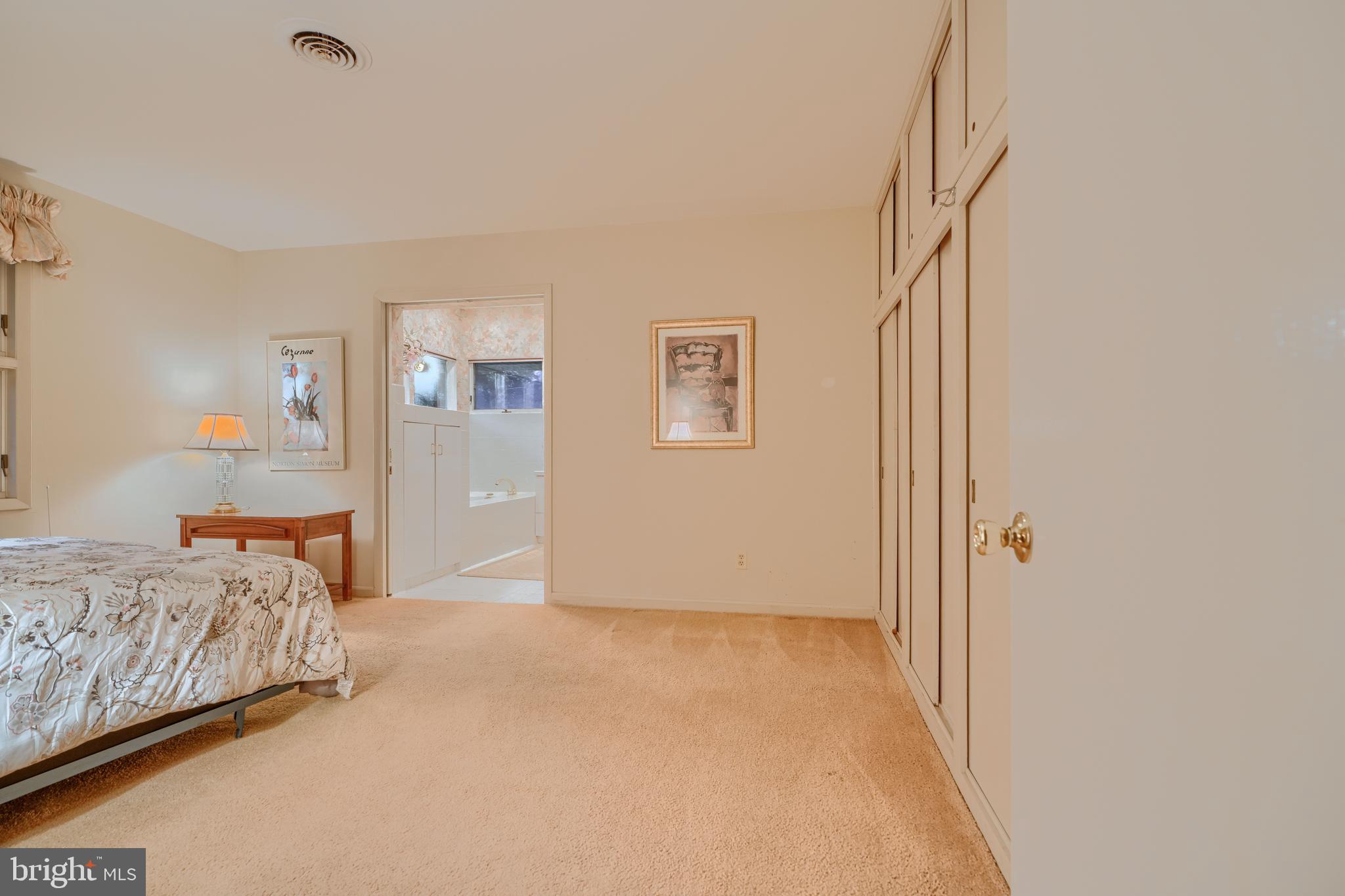 7900 Ivy Lane Baltimore, MD 21208 - Photo 23 of 32 a bedroom with a bed and a cabinets