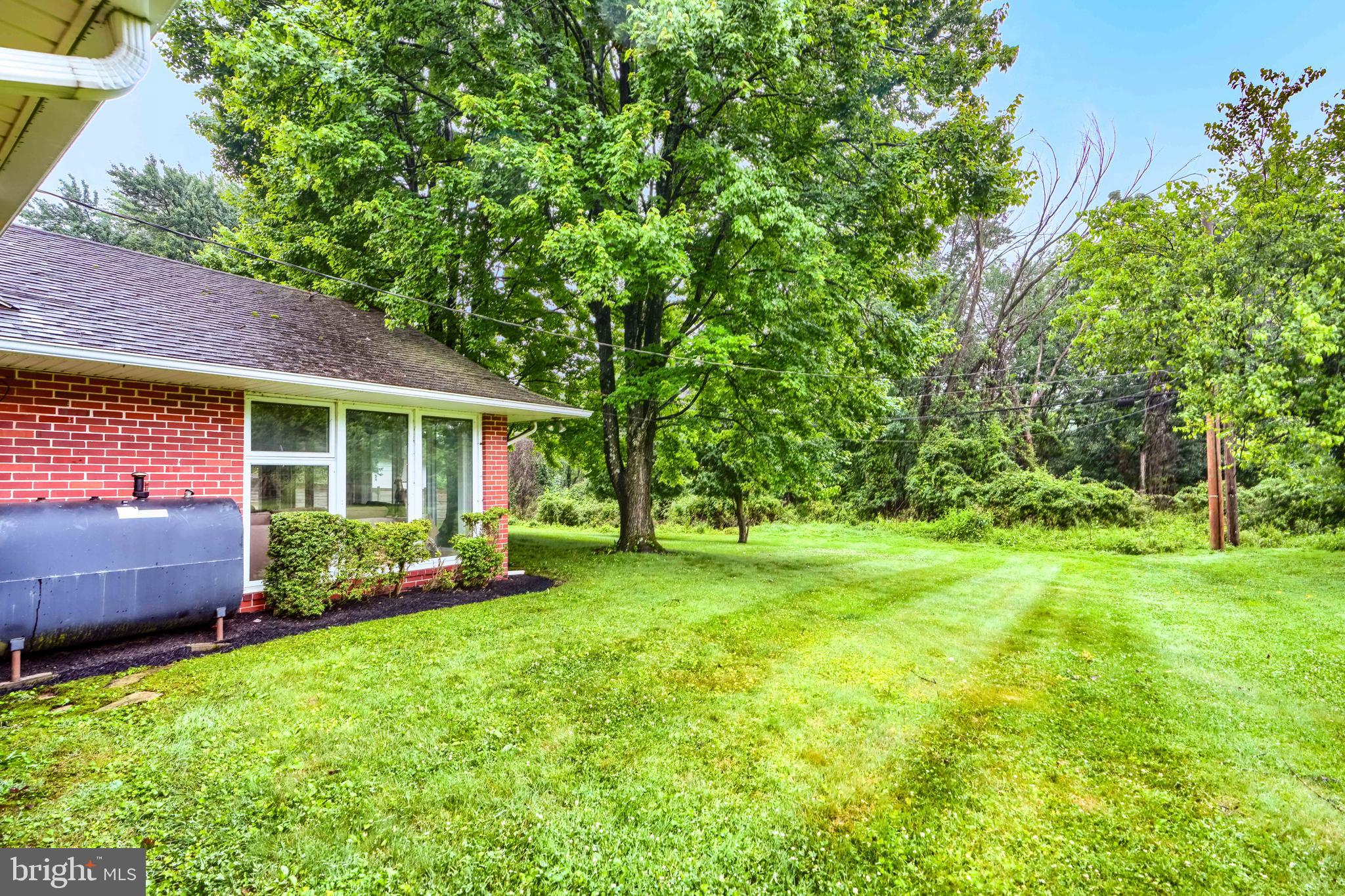 7900 Ivy Lane Baltimore, MD 21208 - Photo 31 of 32 a view of a house with a yard and sitting area