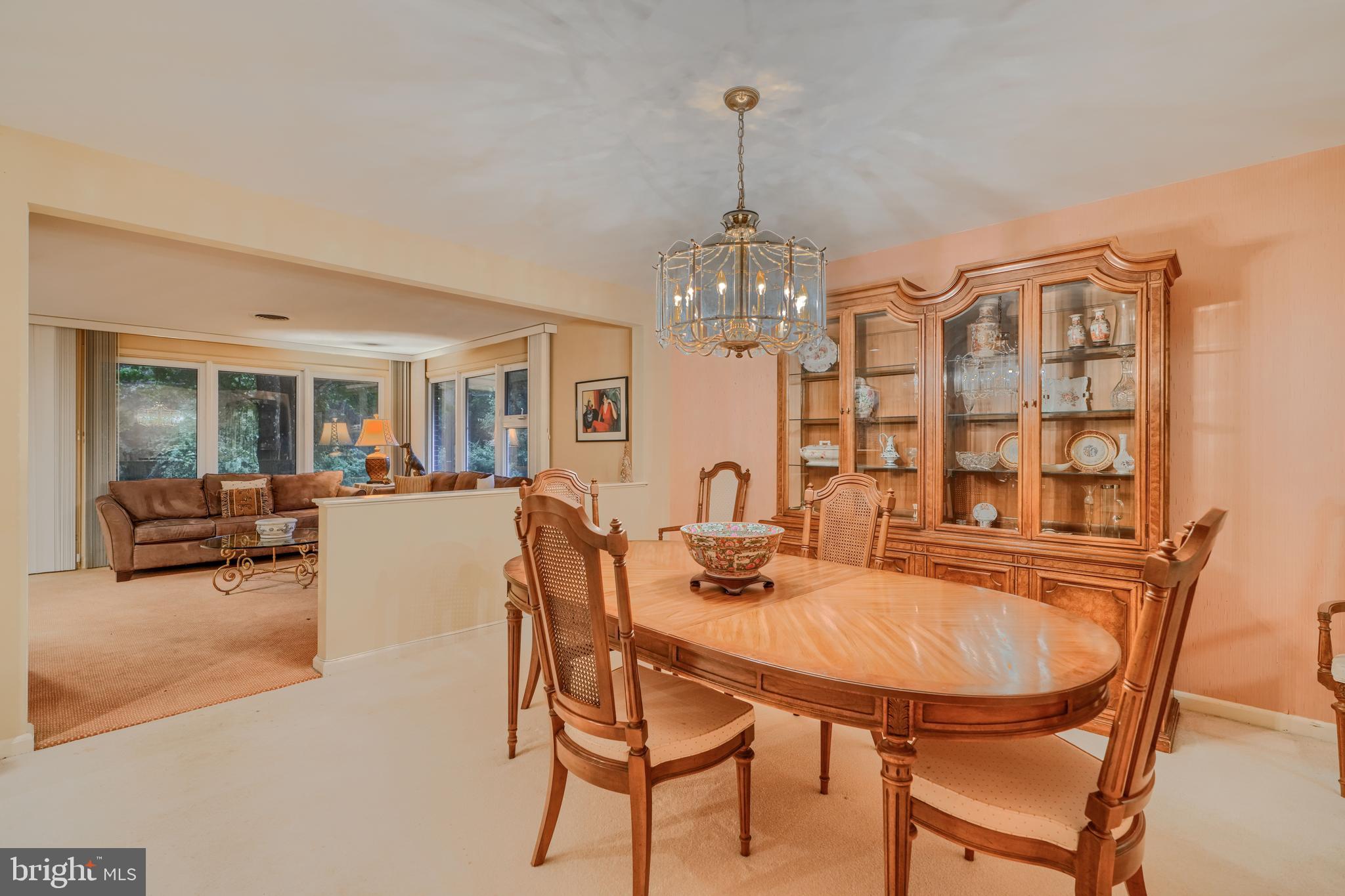 7900 Ivy Lane Baltimore, MD 21208 - Photo 10 of 32 a view of a dining room with furniture and chandelier