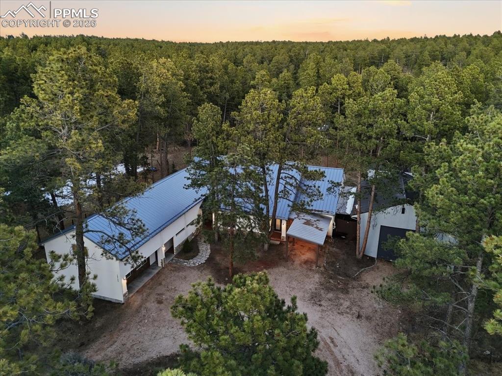 15755 Fool's Gold Lane Colorado Springs, CO 80921 - Photo 1 of 50 an aerial view of a house with a yard