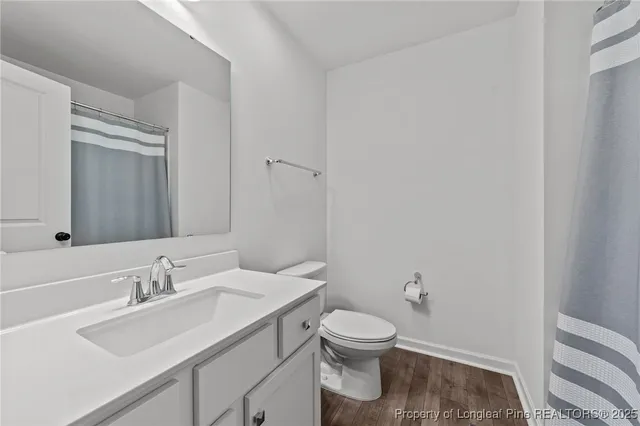 a bathroom with a sink toilet and vanity
