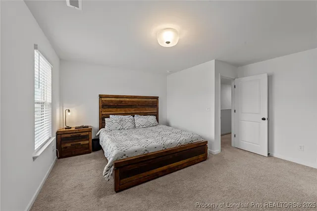 a bedroom with a bed and a cabinets