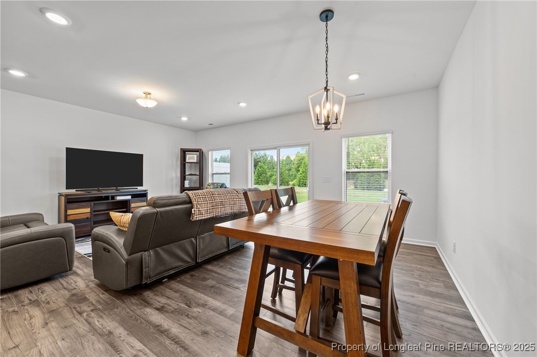 96 Periwinkle Place Clayton, NC 27527 - Photo 8 of 19 a view of a dining room with furniture window and wooden floor