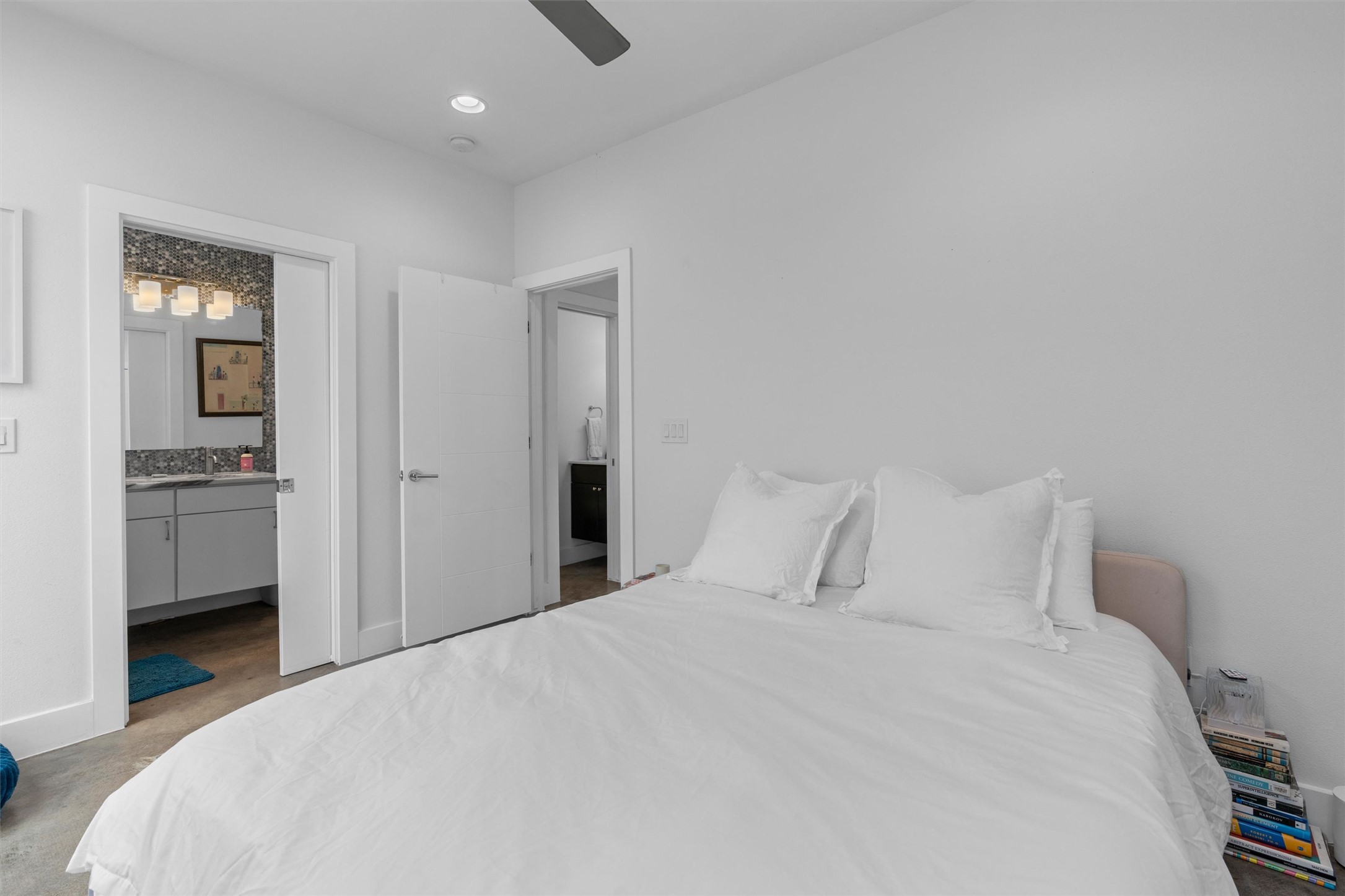 2514 East 4th Street, Unit B Austin, TX 78702 - Photo 11 of 22 a bedroom with a bed and a view of kitchen