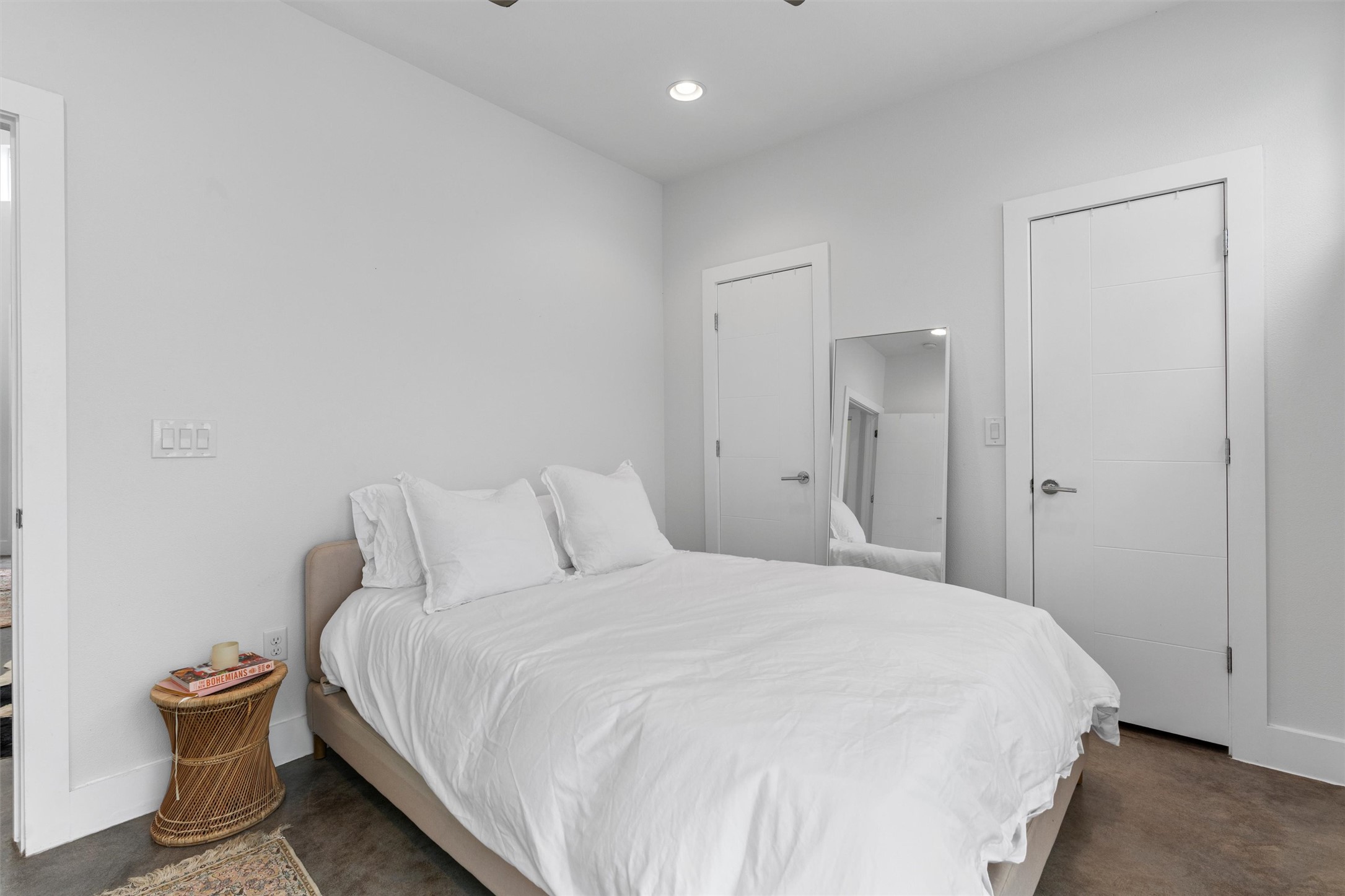 2514 East 4th Street, Unit B Austin, TX 78702 - Photo 12 of 22 a bedroom with a bed and a night stand