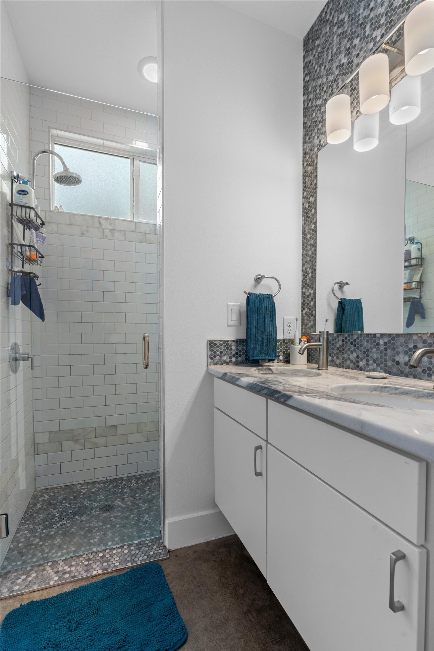 2514 East 4th Street, Unit B Austin, TX 78702 - Photo 14 of 22 a bathroom with a granite countertop sink mirror and shower