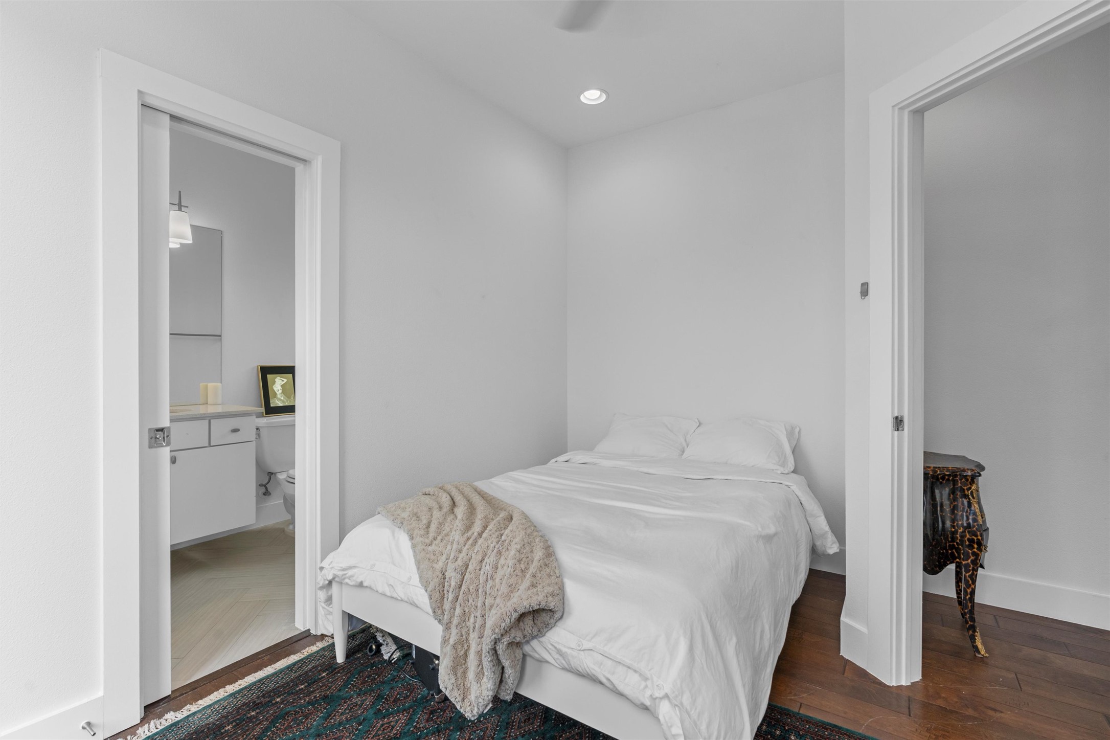 2514 East 4th Street, Unit B Austin, TX 78702 - Photo 15 of 22 a bedroom with a bed and a table in it