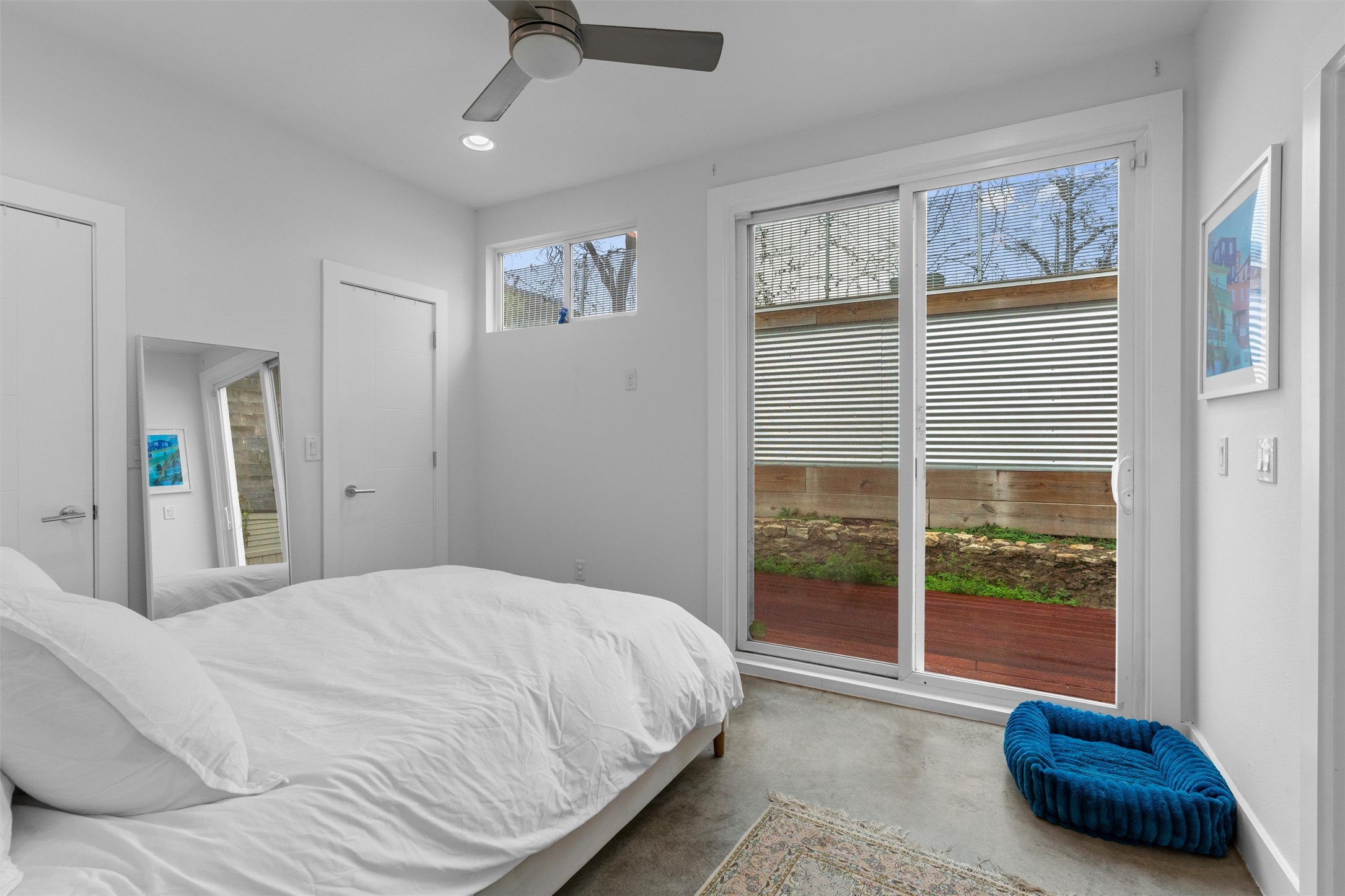 2514 East 4th Street, Unit B Austin, TX 78702 - Photo 10 of 22 a bedroom with a bed and glass window