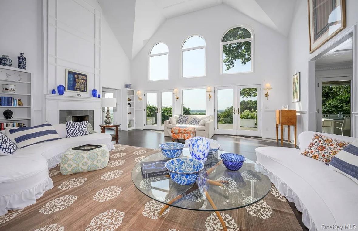 972 Noyac Path Water Mill, NY 11976 - Photo 12 of 40 a living room with fireplace furniture and a large window
