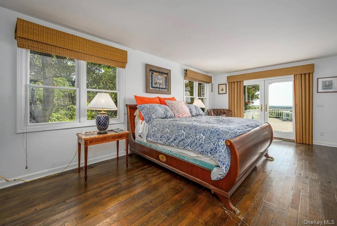 972 Noyac Path Water Mill, NY 11976 - Photo 18 of 40 a bedroom with a bed and wooden floor