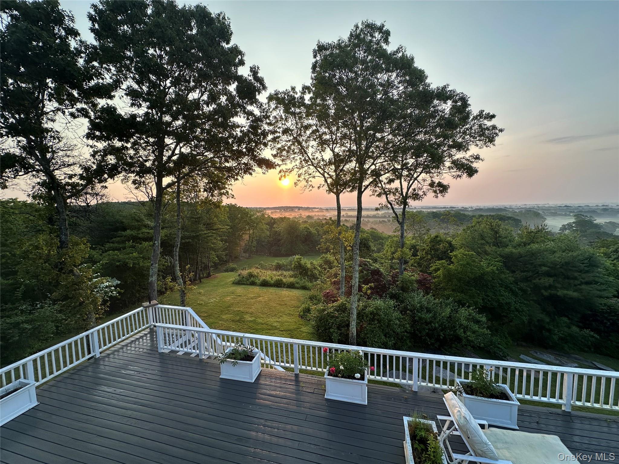 972 Noyac Path Water Mill, NY 11976 - Photo 2 of 40 a view of a deck with mountain view and wooden floor