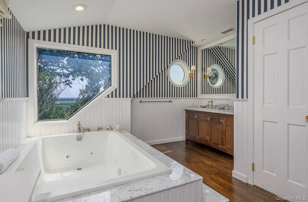 972 Noyac Path Water Mill, NY 11976 - Photo 21 of 40 a bathroom with a tub a sink and a window