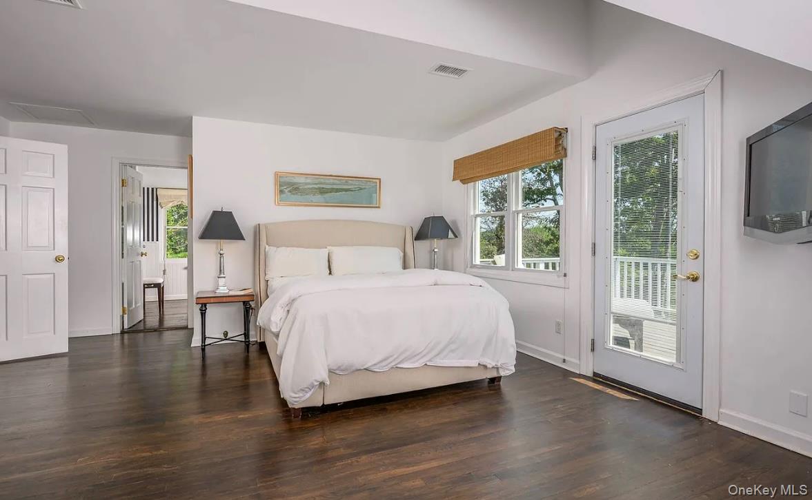 972 Noyac Path Water Mill, NY 11976 - Photo 24 of 40 a bedroom with a large bed and a tv