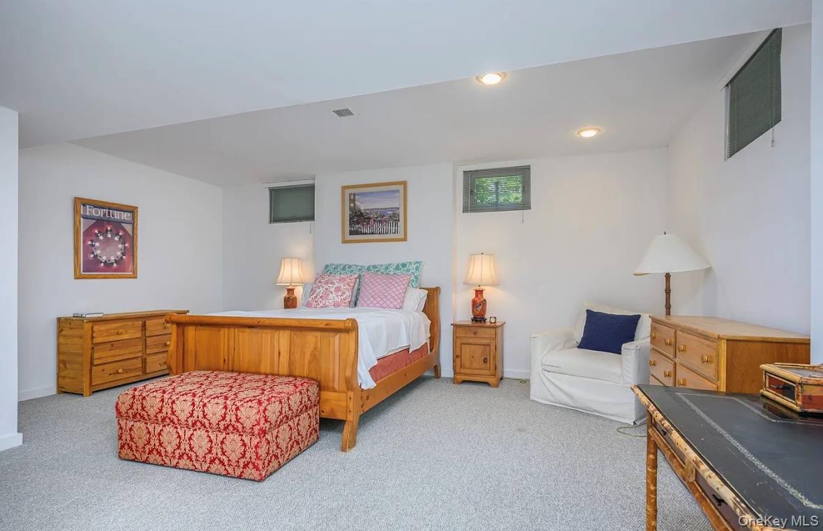 972 Noyac Path Water Mill, NY 11976 - Photo 33 of 40 a bedroom with a bed and dresser