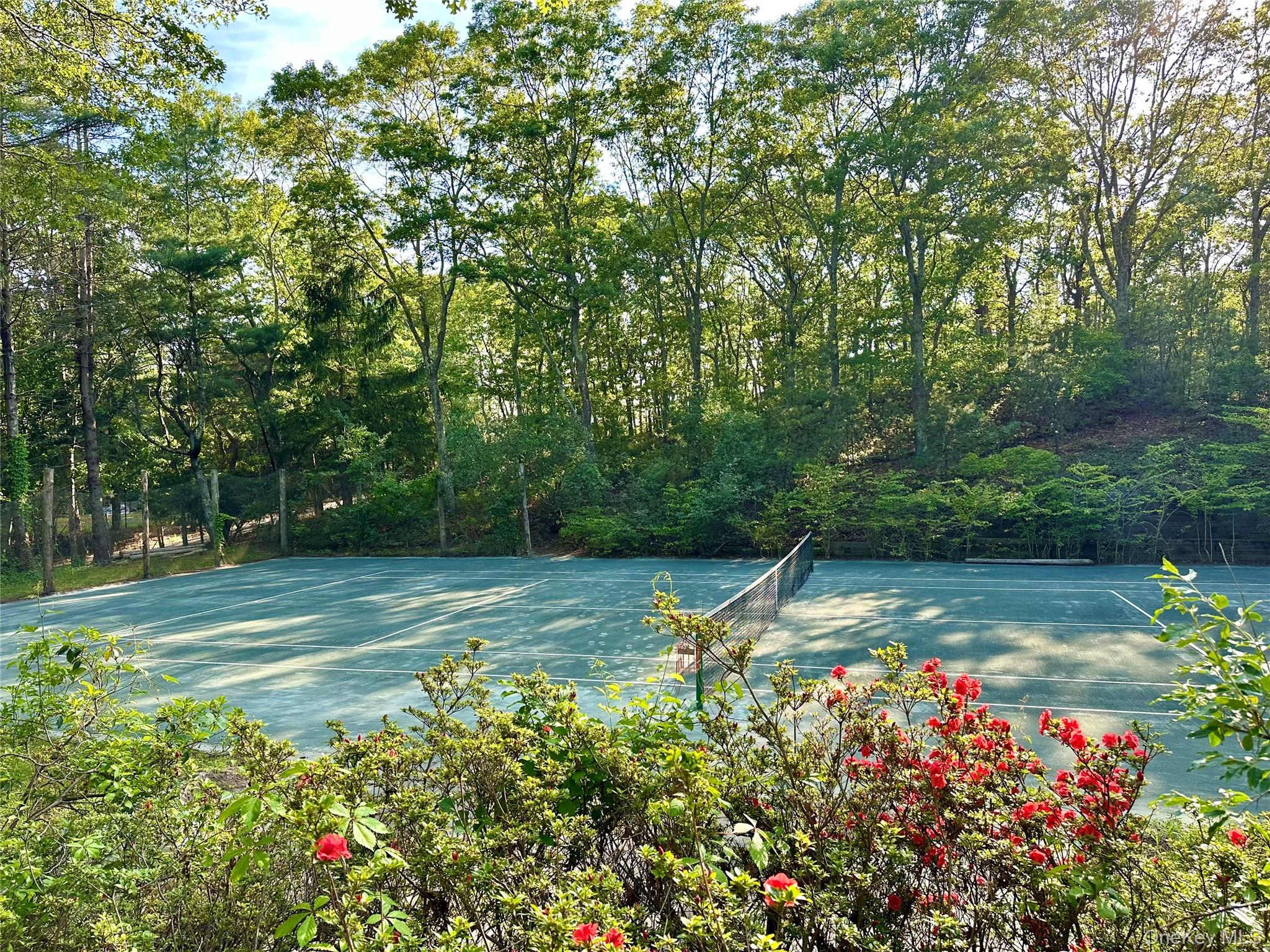 972 Noyac Path Water Mill, NY 11976 - Photo 7 of 40 a view of a garden with a fountain