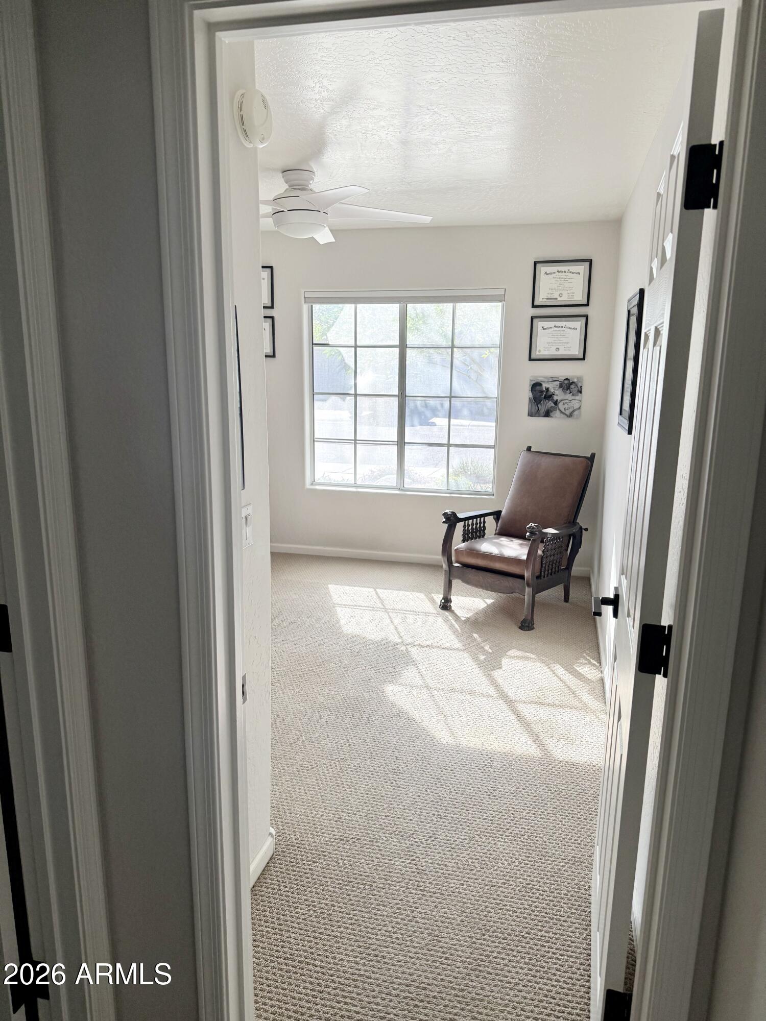3426 East Clark Road Phoenix, AZ 85050 - Photo 11 of 48 a living room with furniture and a large window