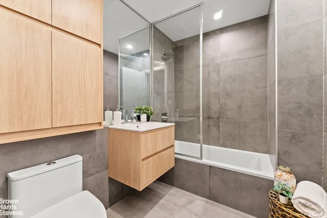 a bedroom with a bed and a rug