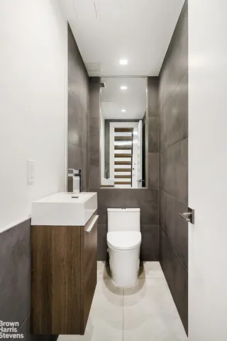 a utility room with sink dryer and washer