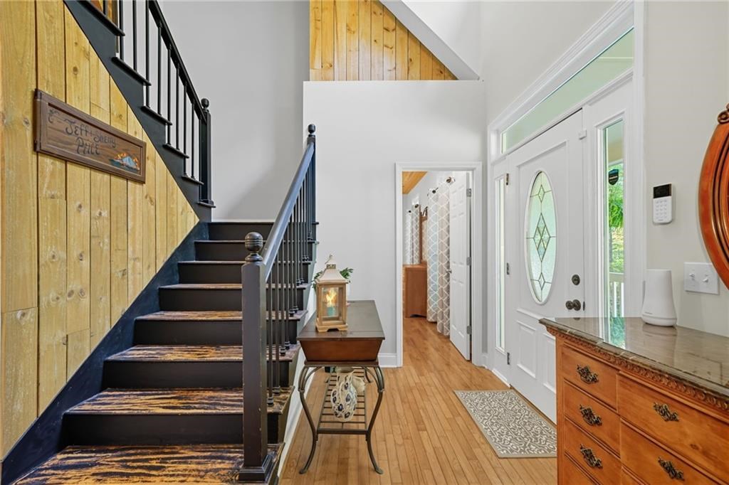 491 Hyde Road Jasper, GA 30143 - Photo 16 of 60 a view of a hallway to a livingroom with wooden floor and staircase